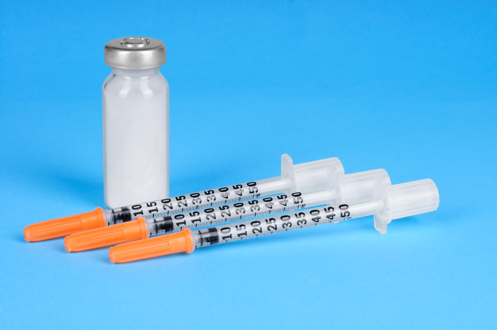 syringes and a bottle